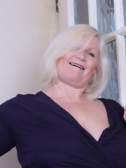 Big breasted British mature lady playing with herself