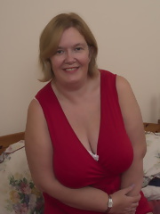 Large British mature lady with big natural tits getting dirty