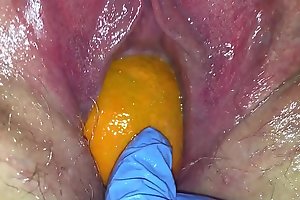 Tight pussy mummy gets their way pussy weakened close to a orange and metropolis popping it out of their way tight hole council their way squirt