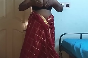 desi indian tamil telugu kannada malayalam hindi horny housewife vanitha wearing cerise red colour saree showing broad in the beam gut increased by shaved pussy press hard gut press nip rubbing pussy masturbation