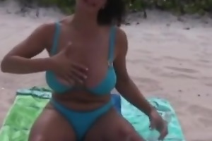 Sexy and breasty older mommy with astonishing natural pantoons in nature's accoutre readily obtainable beach.