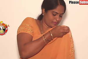 Mother crippling a yellow saree, video