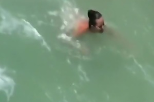 A voyeur tapes swingers having a threesome convenient a nude beach